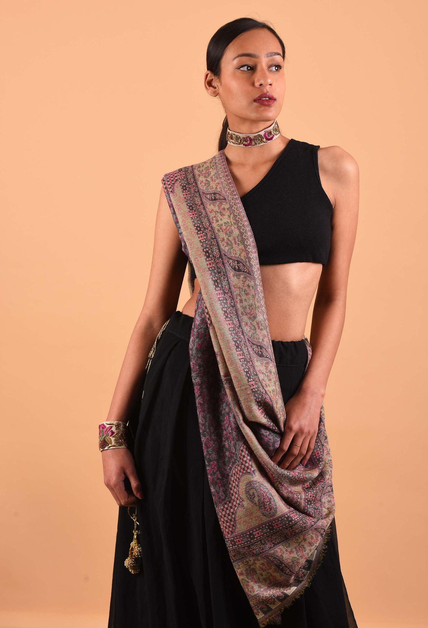 Luxury camel wool shawl with traditional Indian weaving, worn by model, perfect for winter warmth and elegance.