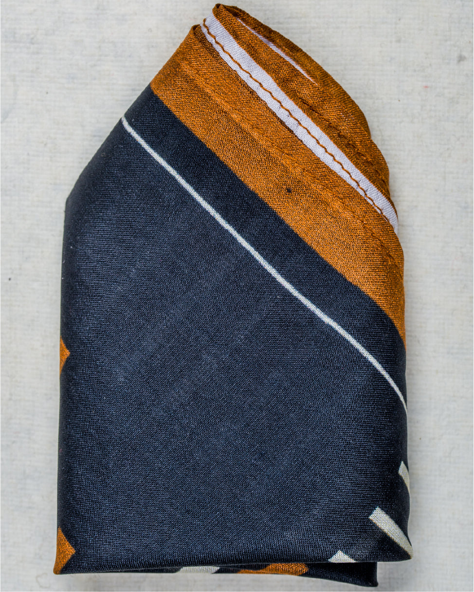 Close-up of striped black and brown pocket square fabric with elegant design