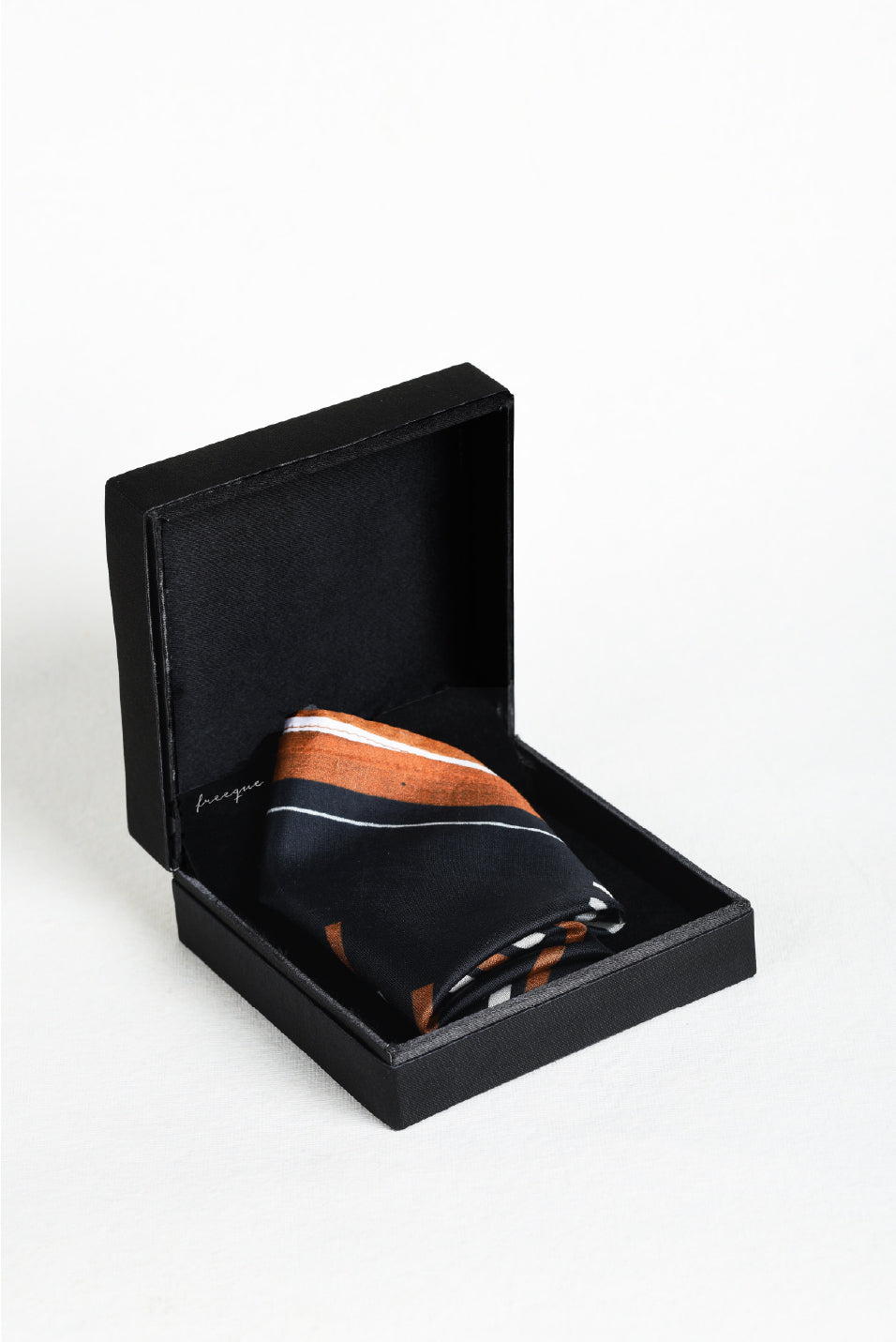 Striped black and brown scented pocket square in luxury packaging
