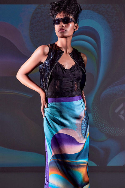 Model in vibrant light wearing the Epipháneia scarf with Freeque monogram detail.