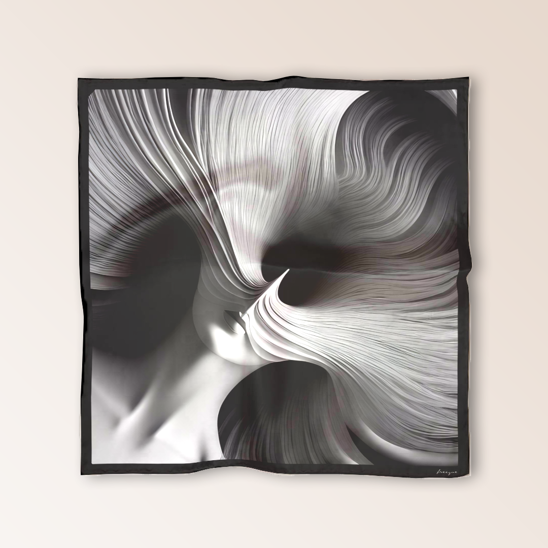 Flat lay of Freeque’s L'Esprit Fluctuant scented luxury scarf in black silk, featuring an abstract, ethereal design.