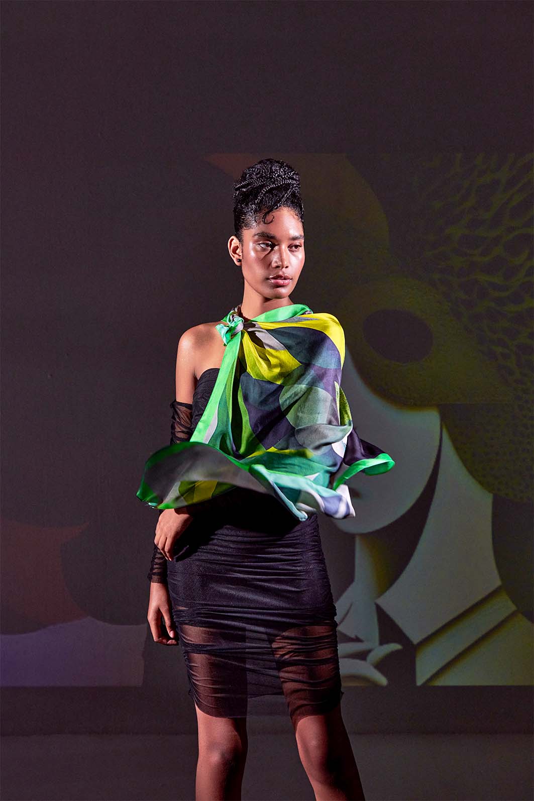 Model styling Metamorphosis Transformation scarf in dark setting