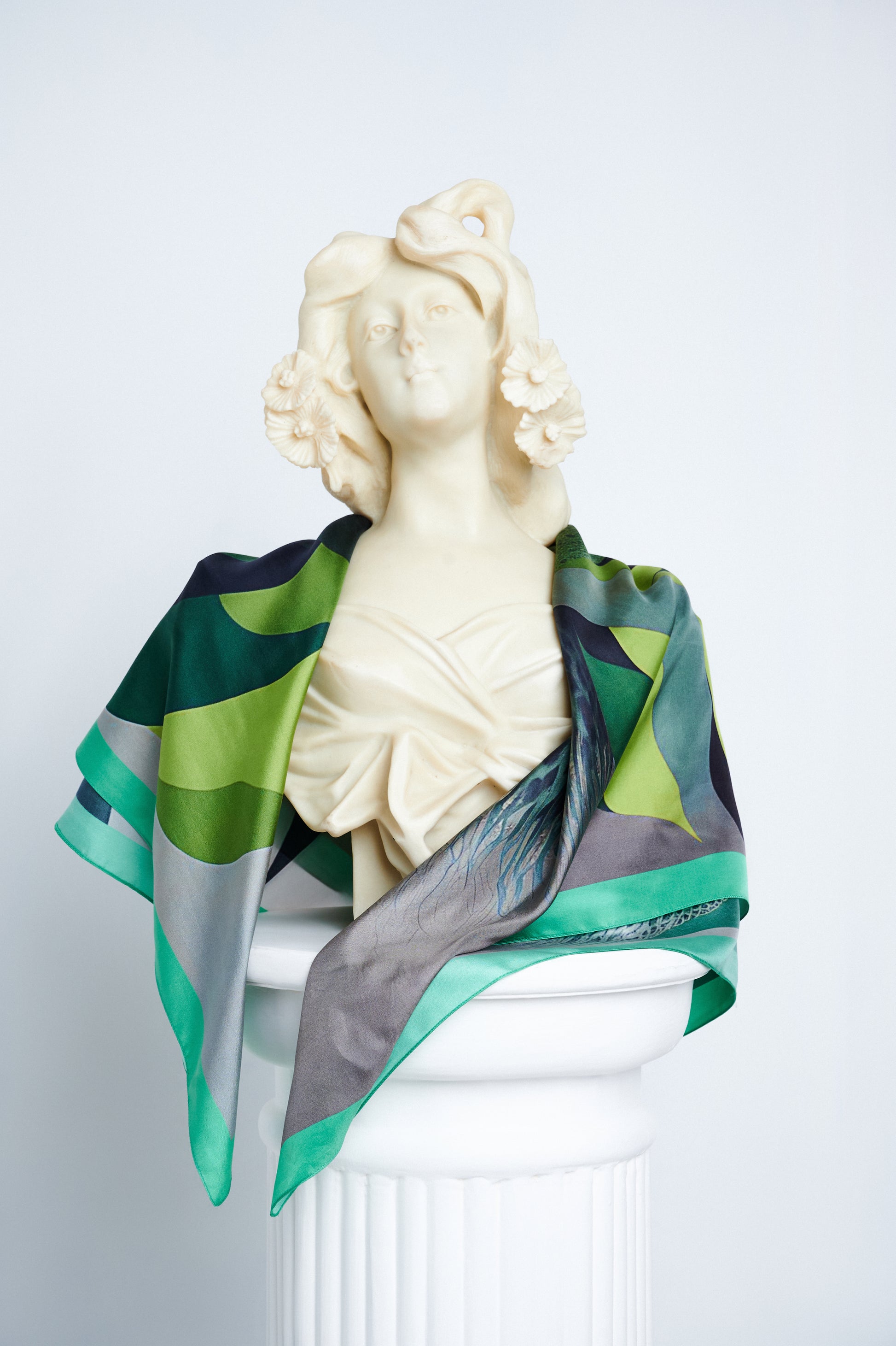 Metamorphosis Transformation scarf draped on a classical sculpture