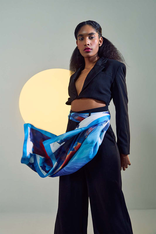 Image of model wearing the Oneirodýni "Emotional Multiplicity" scarf from Freeque's Hygieia Collection in an artful, surrealist-inspired styling.
