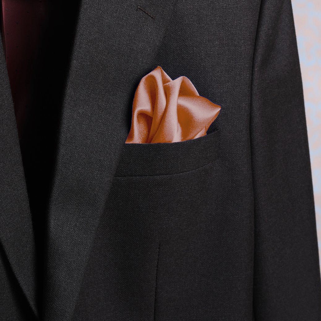 Solid apricot scented pocket square in suit pocket - luxury accessory by Freeque.