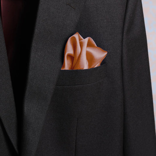 Solid apricot scented pocket square in suit pocket - luxury accessory by Freeque.