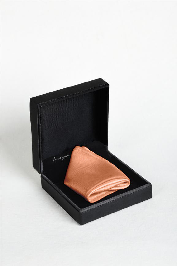 Solid apricot satin silk pocket square displayed in a black gift box