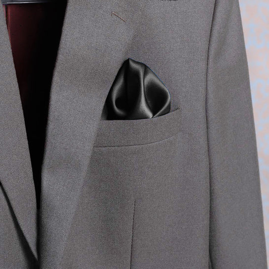 Solid charcoal scented satin silk pocket square in a suit pocket - luxury accessory by Freeque.