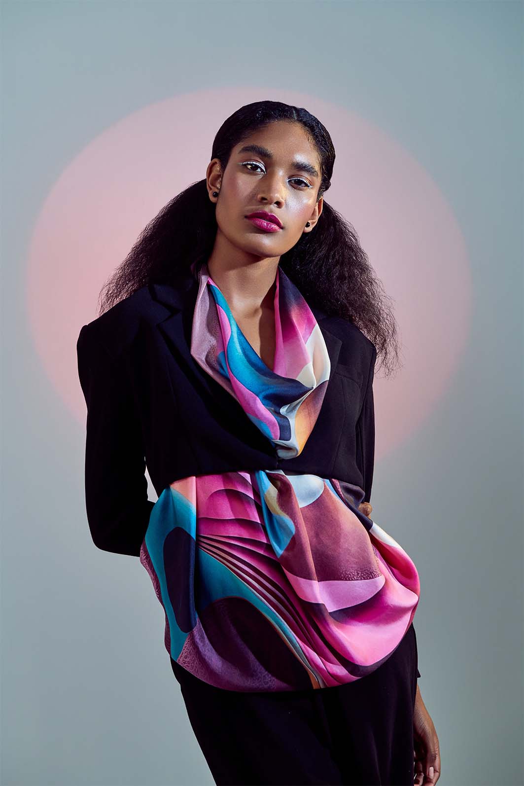 Model elegantly draped in Freeque’s Soufflé luxury scented scarf, showcasing its fluid silk texture and ethereal surrealist design.