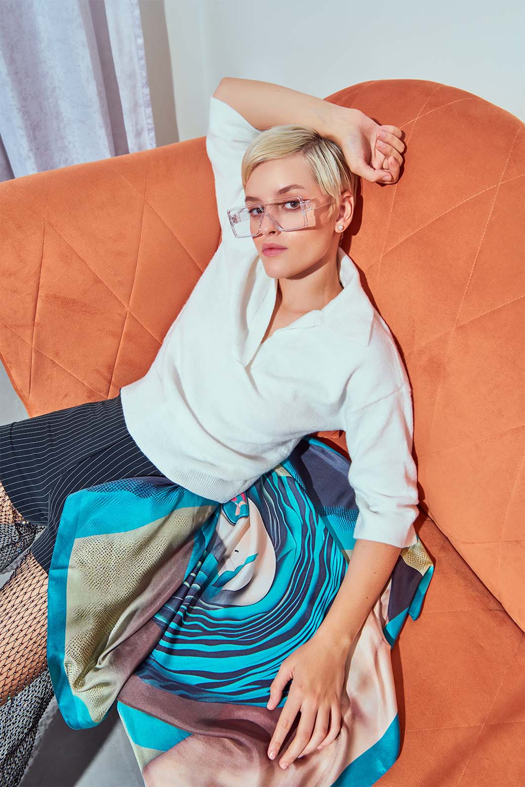 Model wearing Freeque’s Spectre Silencieux scented scarf, inspired by surrealist artistry.