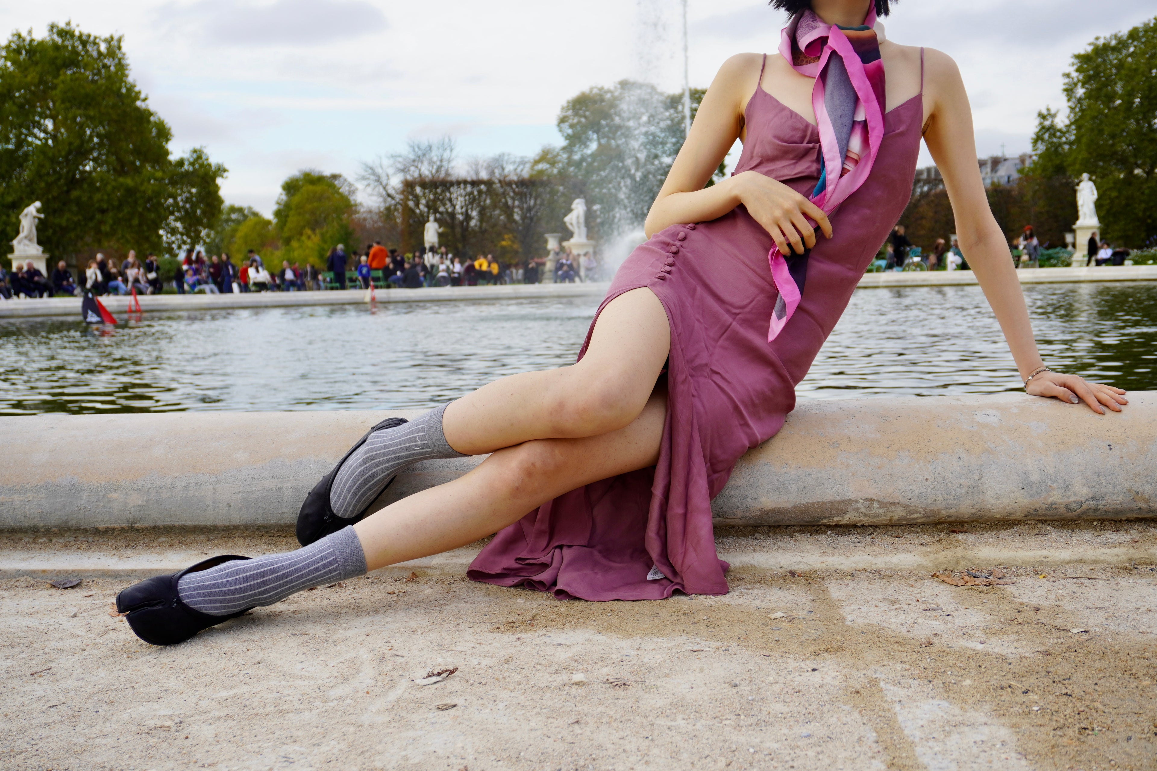 woman wearing Freeque's luxury scented scarf in exotic settings