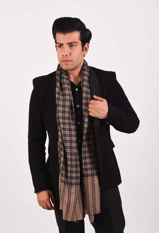 Male model wearing the Harper camel wool stole by Freeque, styled with a black suit for an elegant and luxurious look.