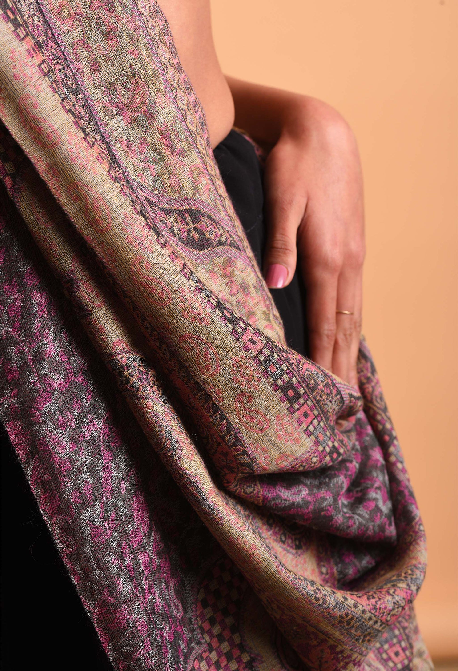 Detailed view of Aidha camel wool shawl with intricate Indian pattern, showcasing luxury fabric texture.