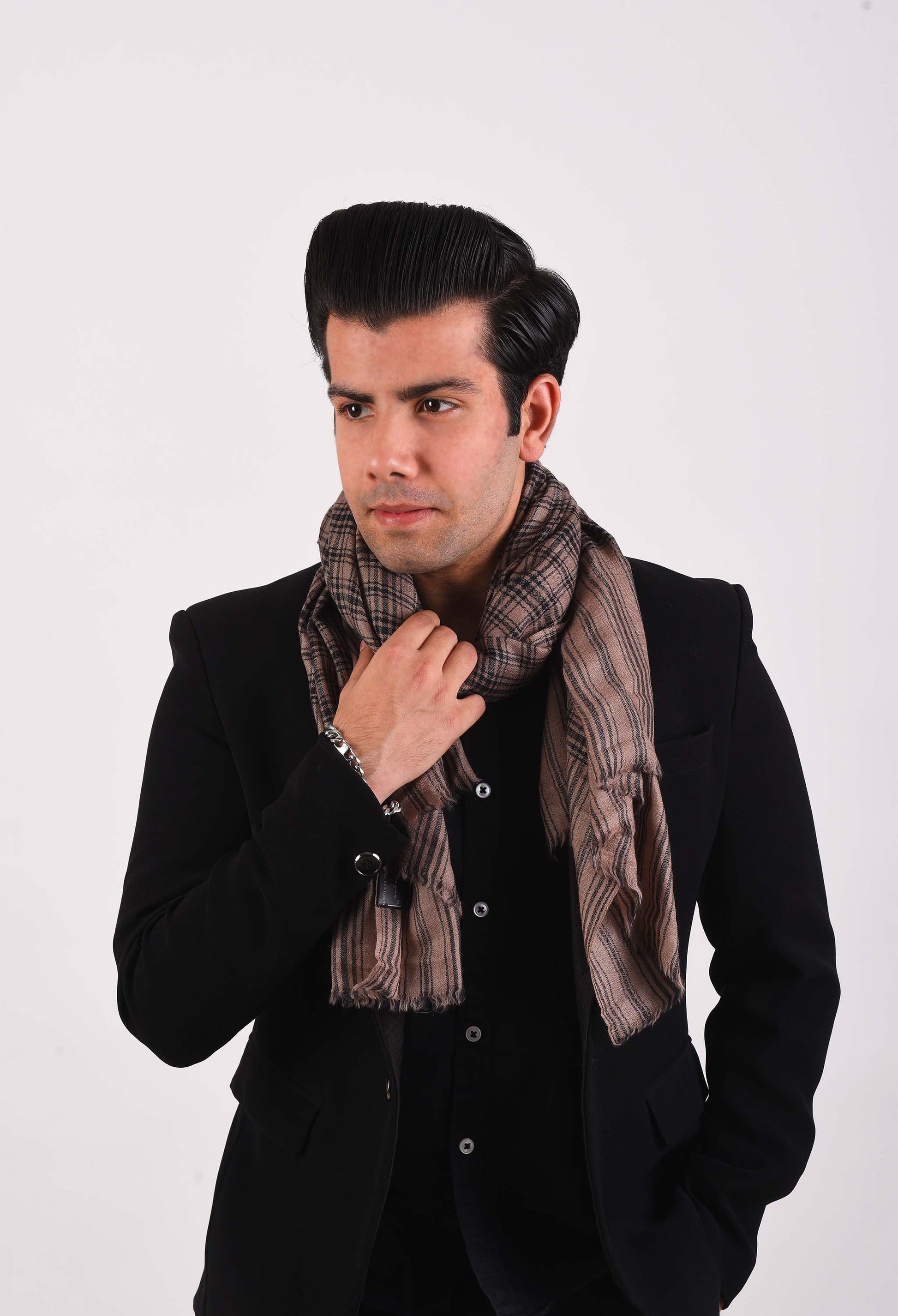 Model in black blazer wearing the Asher camel wool stole, exuding luxury and warmth for winter fashion.