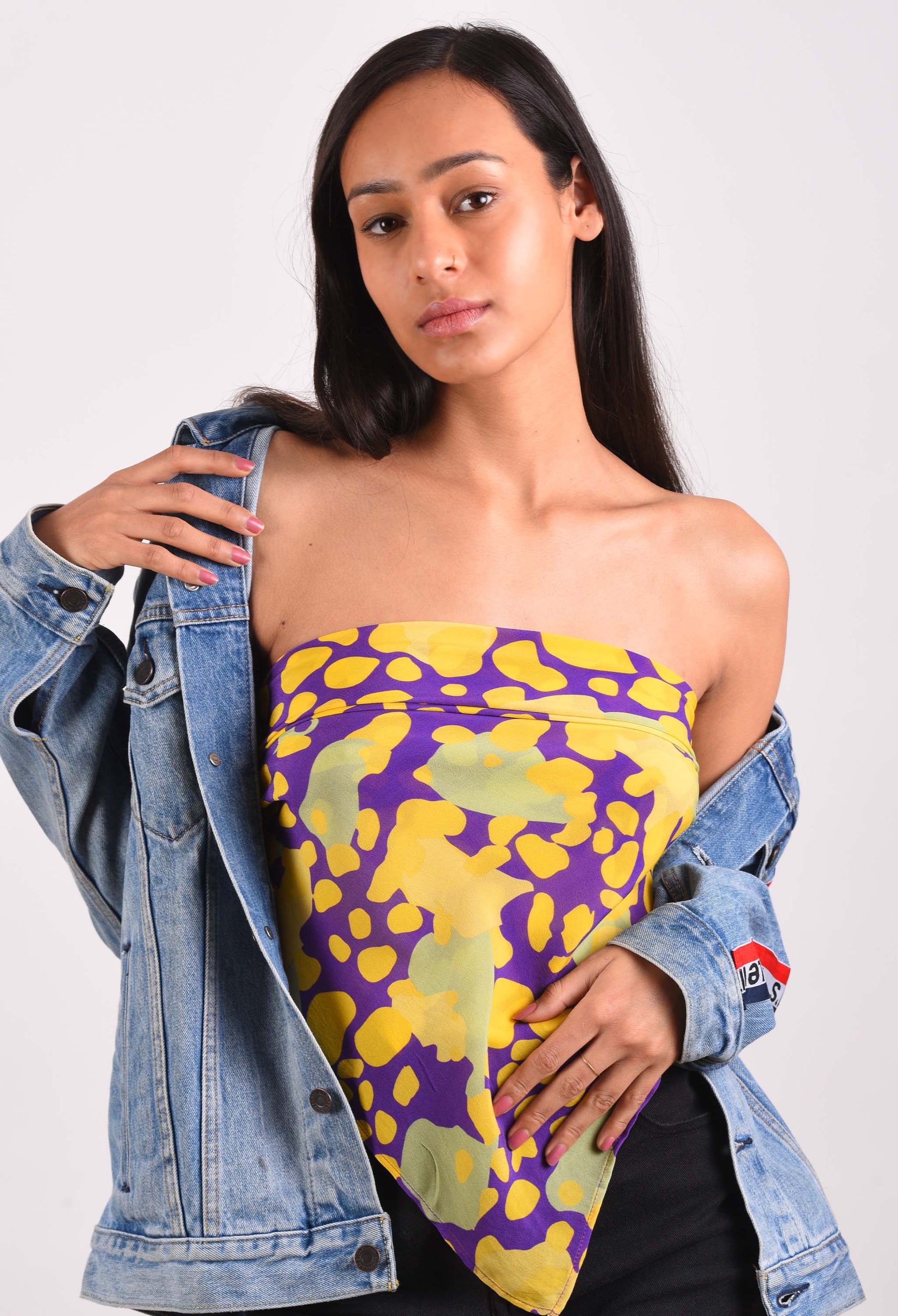 Model styled in the Auber'genius scented scarf paired with a denim jacket, highlighting the luxurious fabric