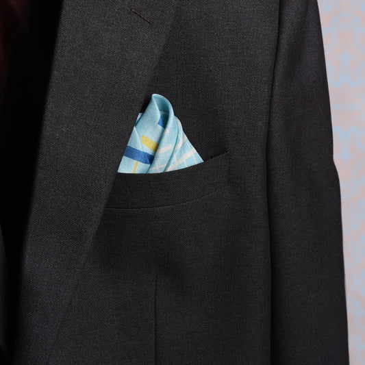 Blue and yellow striped pocket square in a suit pocket for a stylish look.