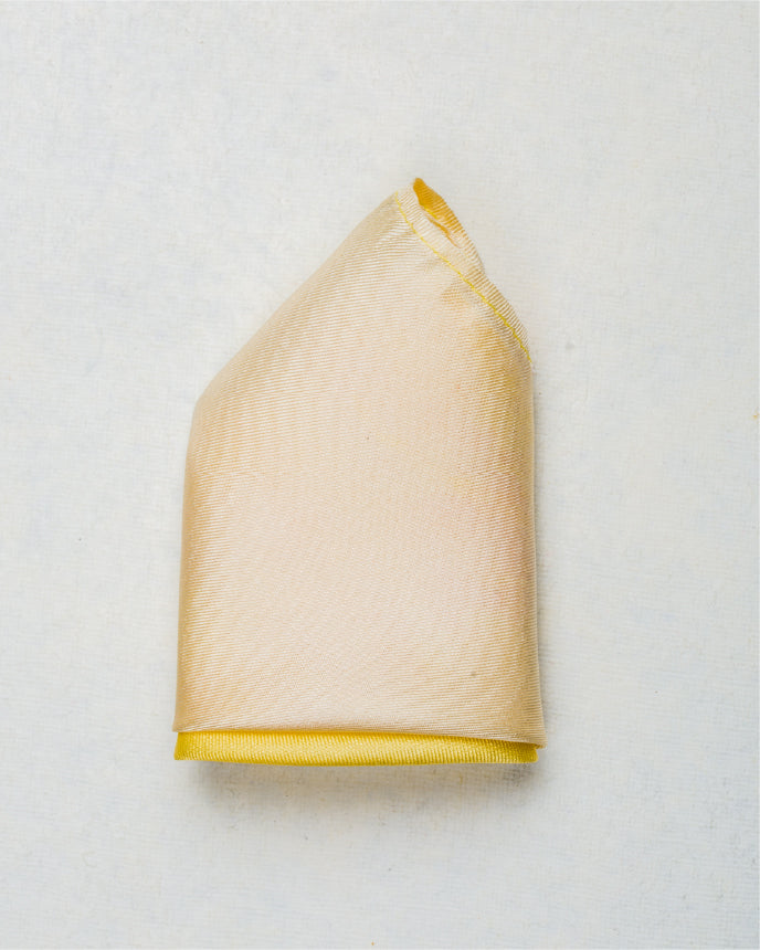 Close-up of ombre yellow scented pocket square in silk twill fabric