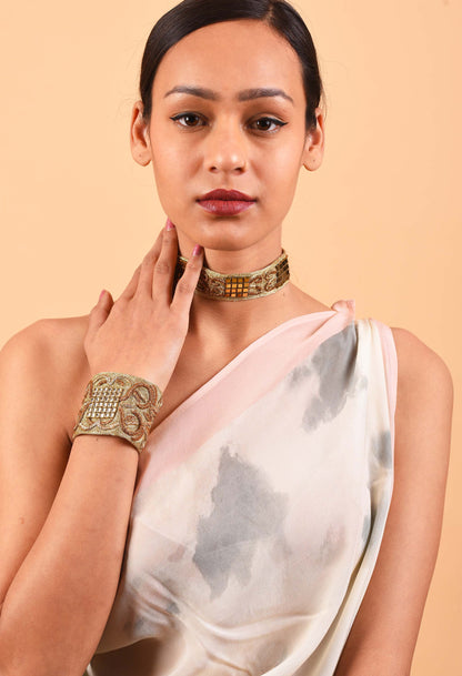 Woman wearing Freeque's handcrafted Dynasty choker and bracelet set, showcasing intricate Indian weaving traditions.