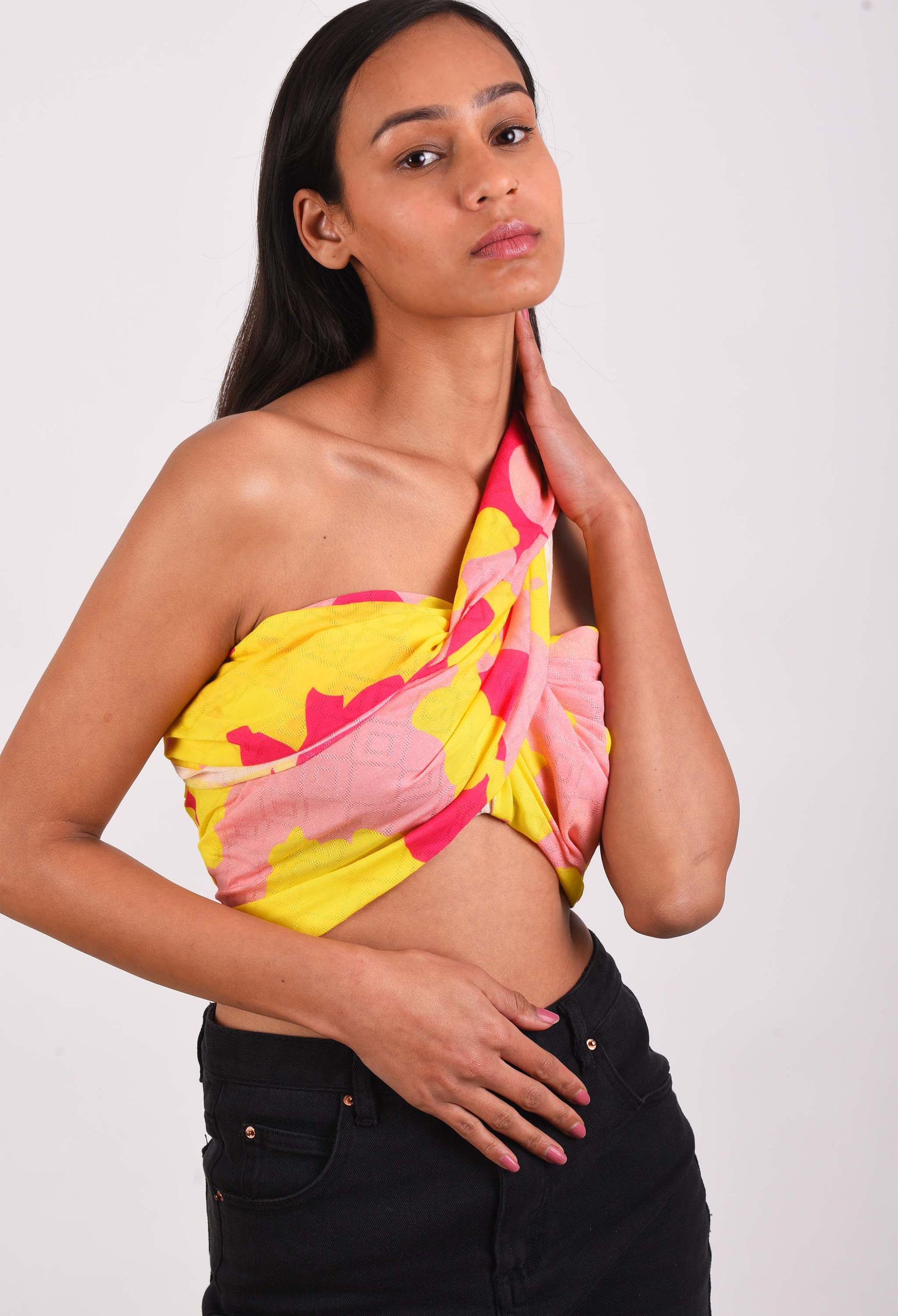 Model wearing Freeque Neon Veil scented stole in vibrant yellow and pink hues