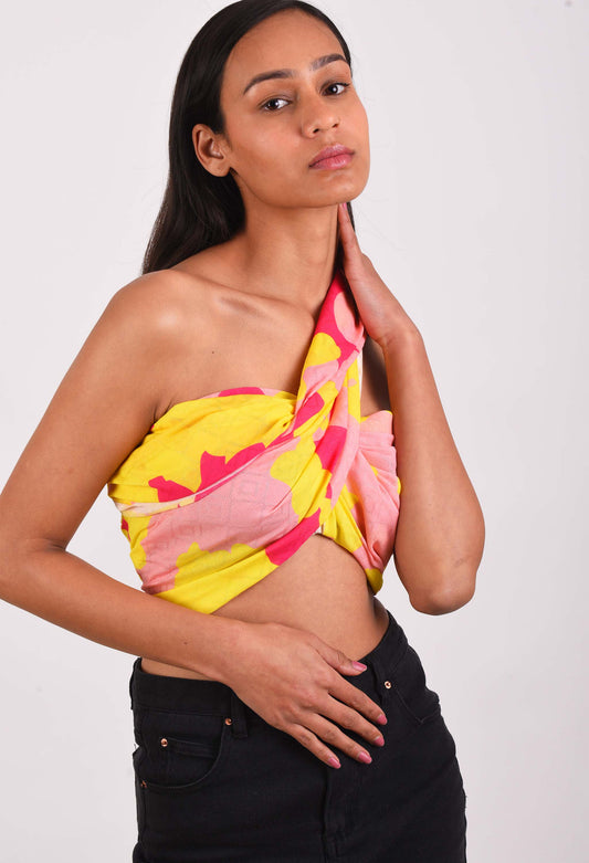 Model wearing Freeque Neon Veil scented stole in vibrant yellow and pink hues