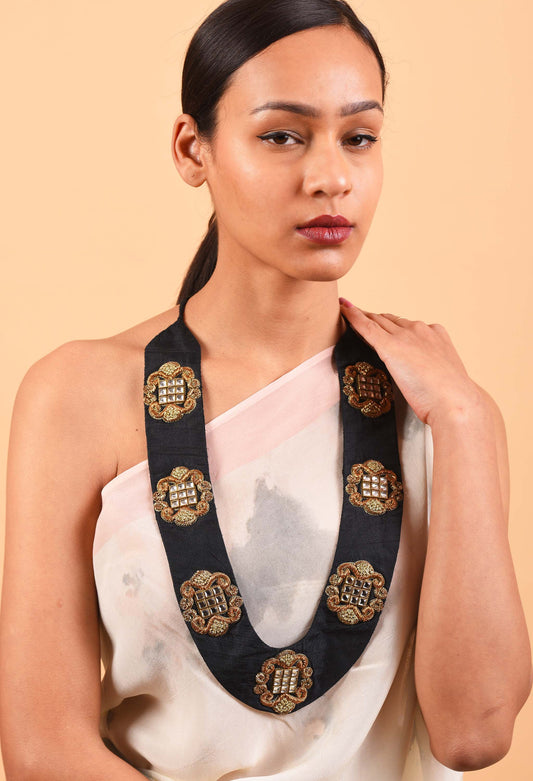 Model wearing Heiress handcrafted necklace with intricate woven details, inspired by Indian heritage.
