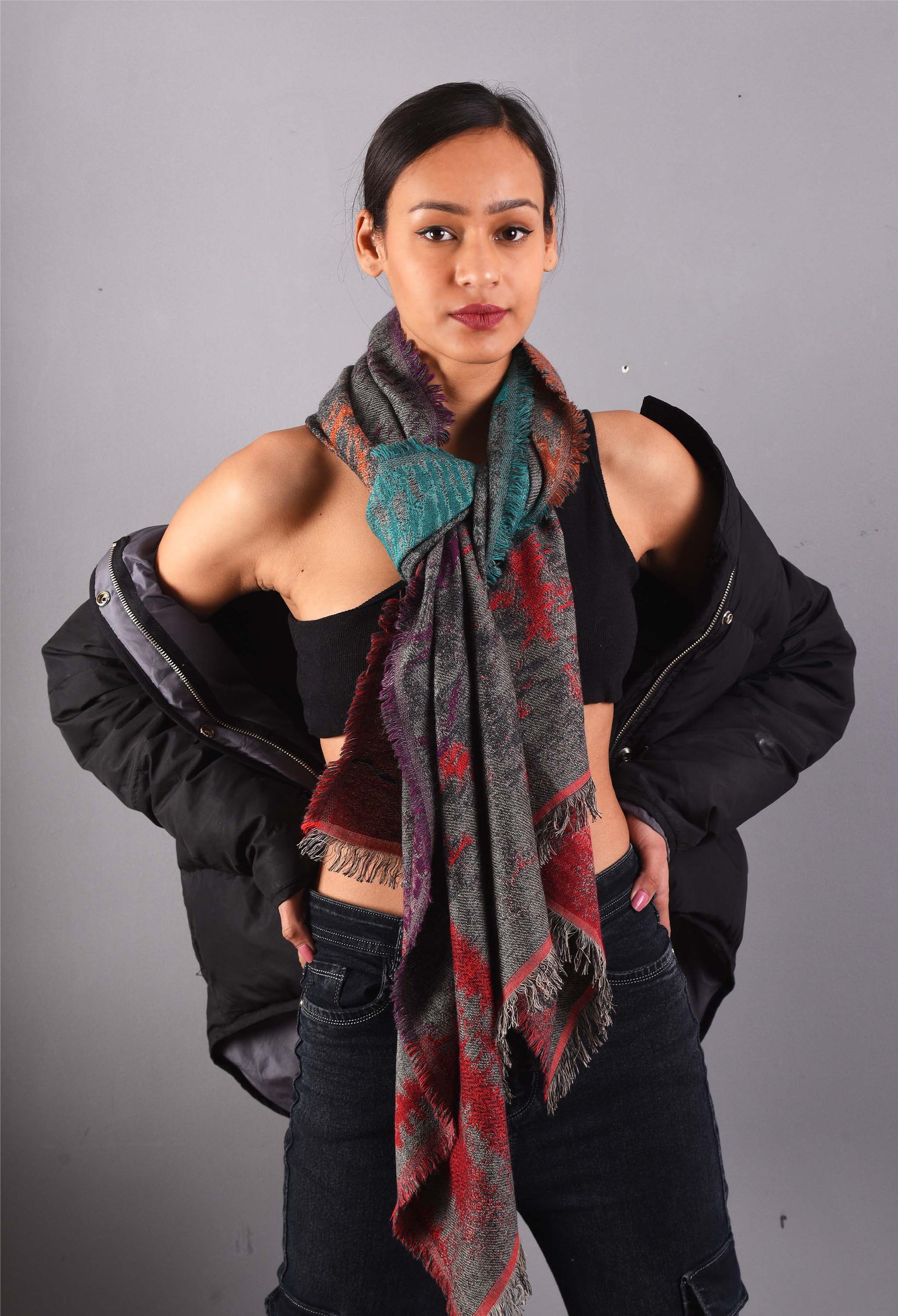 Model wearing Jayden unisex camel wool stole, styled with a black jacket, showcasing a warm winter look.