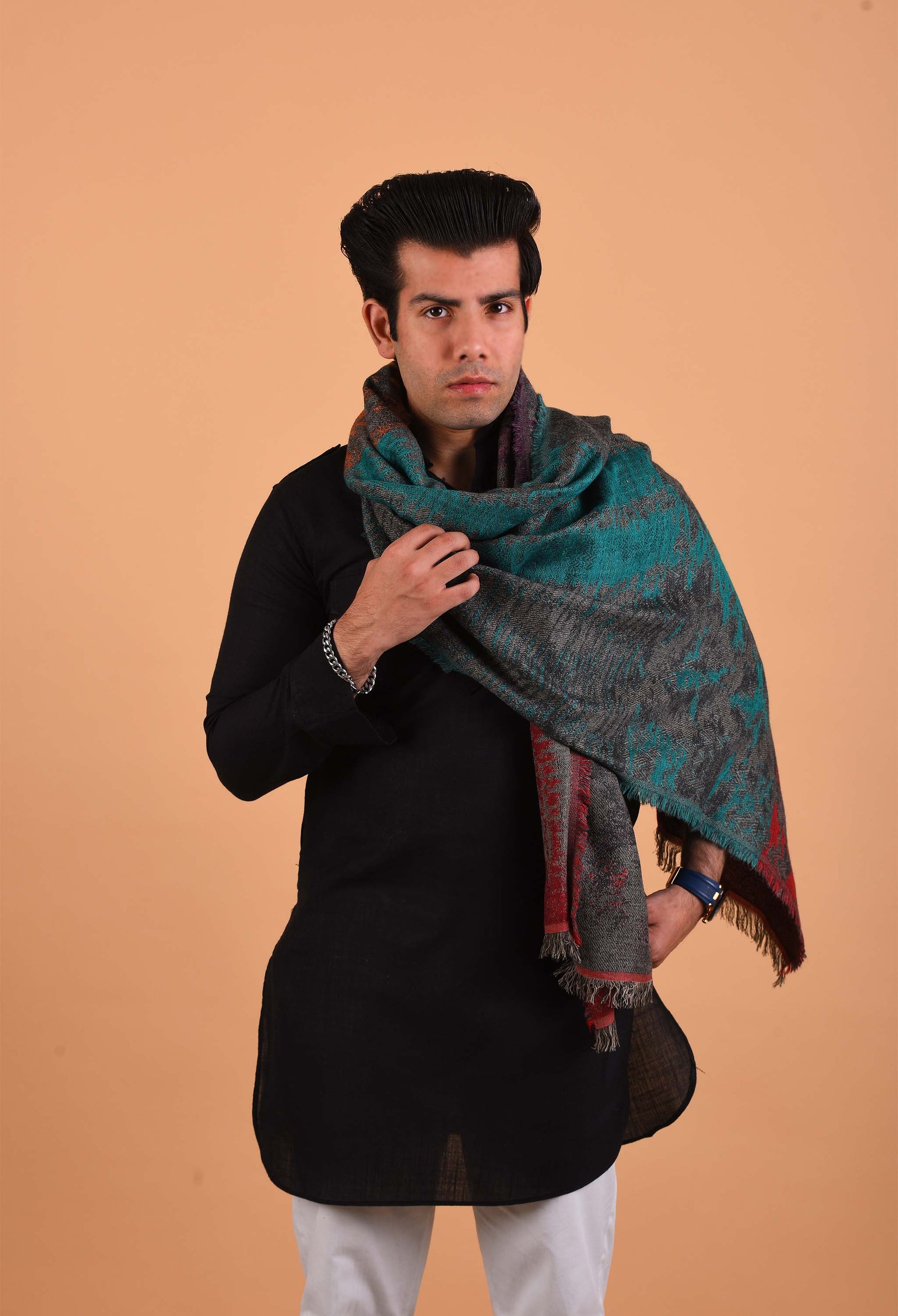 Man posing with Jayden luxurious camel wool stole in black traditional attire.