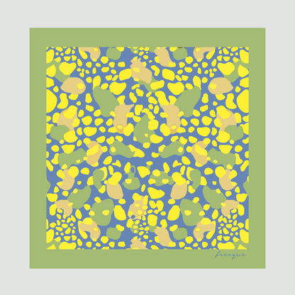 Mirage luxury scented scarf with vibrant yellow and blue pattern against a green border