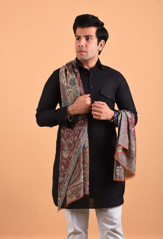 Model wearing Naadira camel wool shawl in intricate traditional pattern