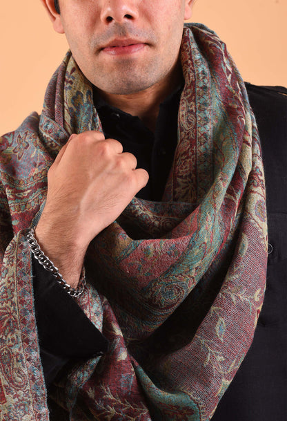 Naadira shawl held gracefully, focusing on rich pattern and fabric quality
