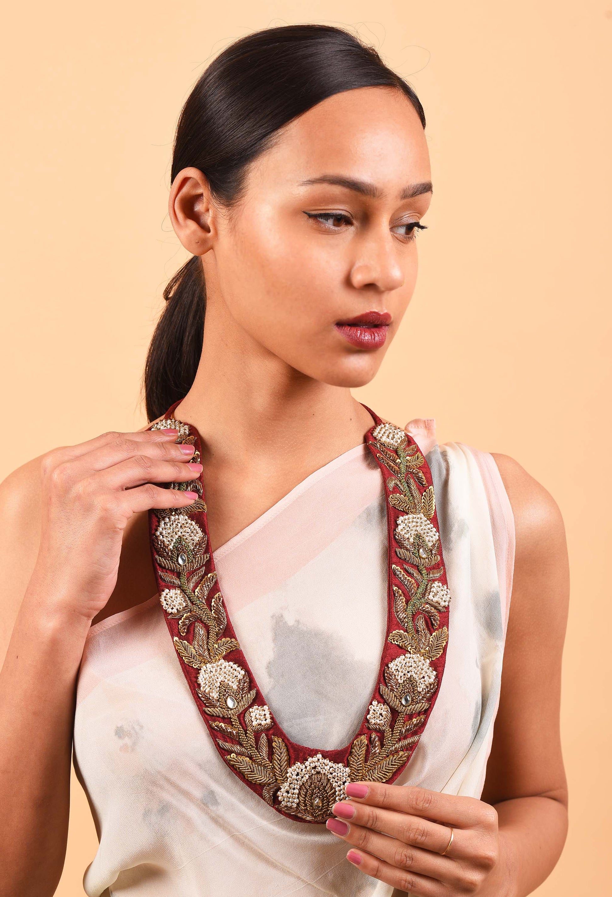 Model wearing handcrafted Red Manor necklace from Freeque’s Fine Jewellery Collection