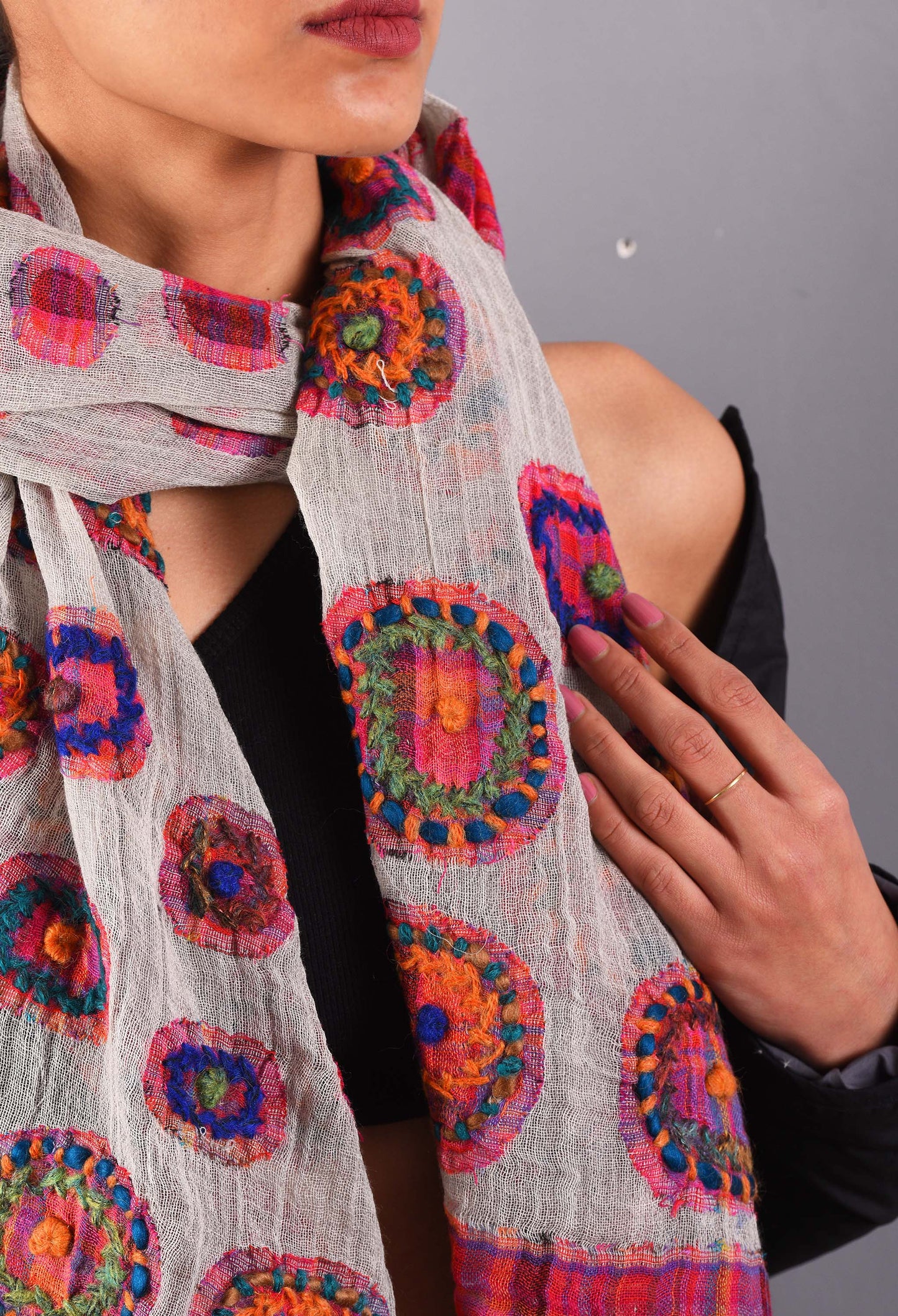 Close-up of Reet camel wool stole with vibrant circle embroidery