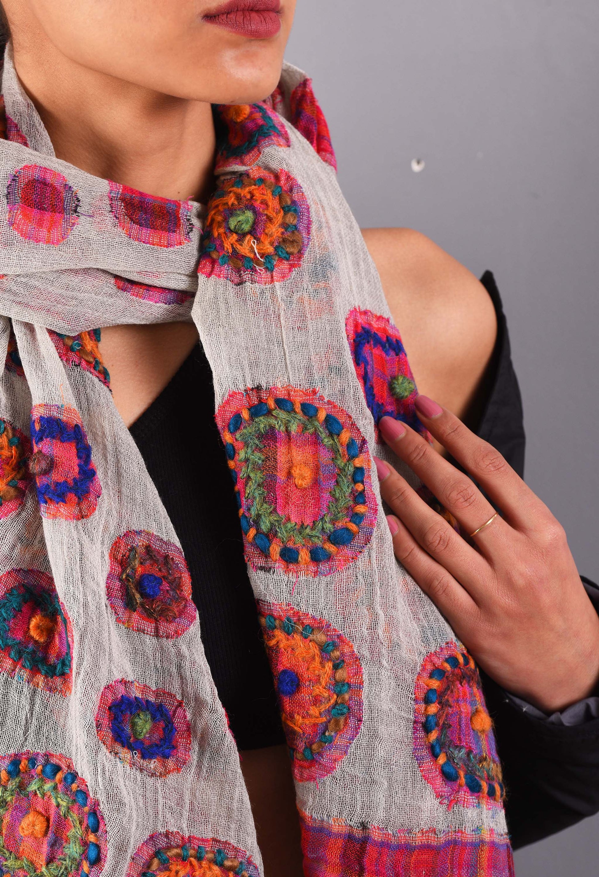 Close-up of Reet camel wool stole with vibrant circle embroidery