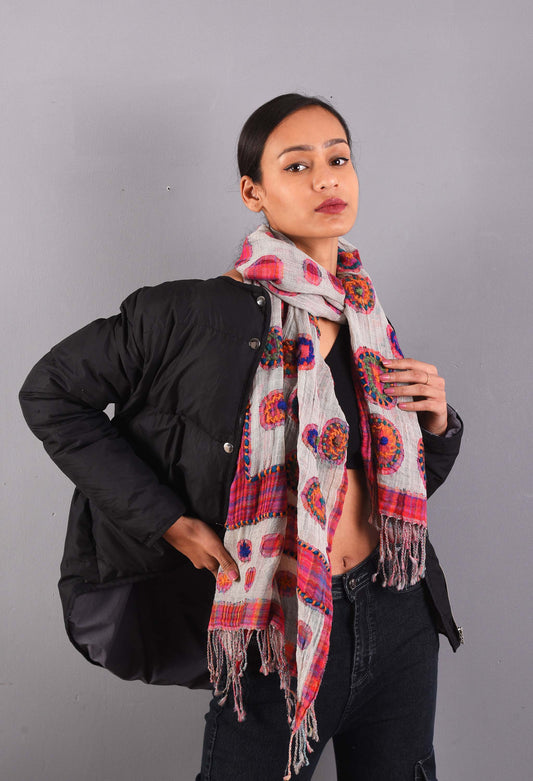 Model wearing Freeque's Reet camel wool stole with colorful circular patterns