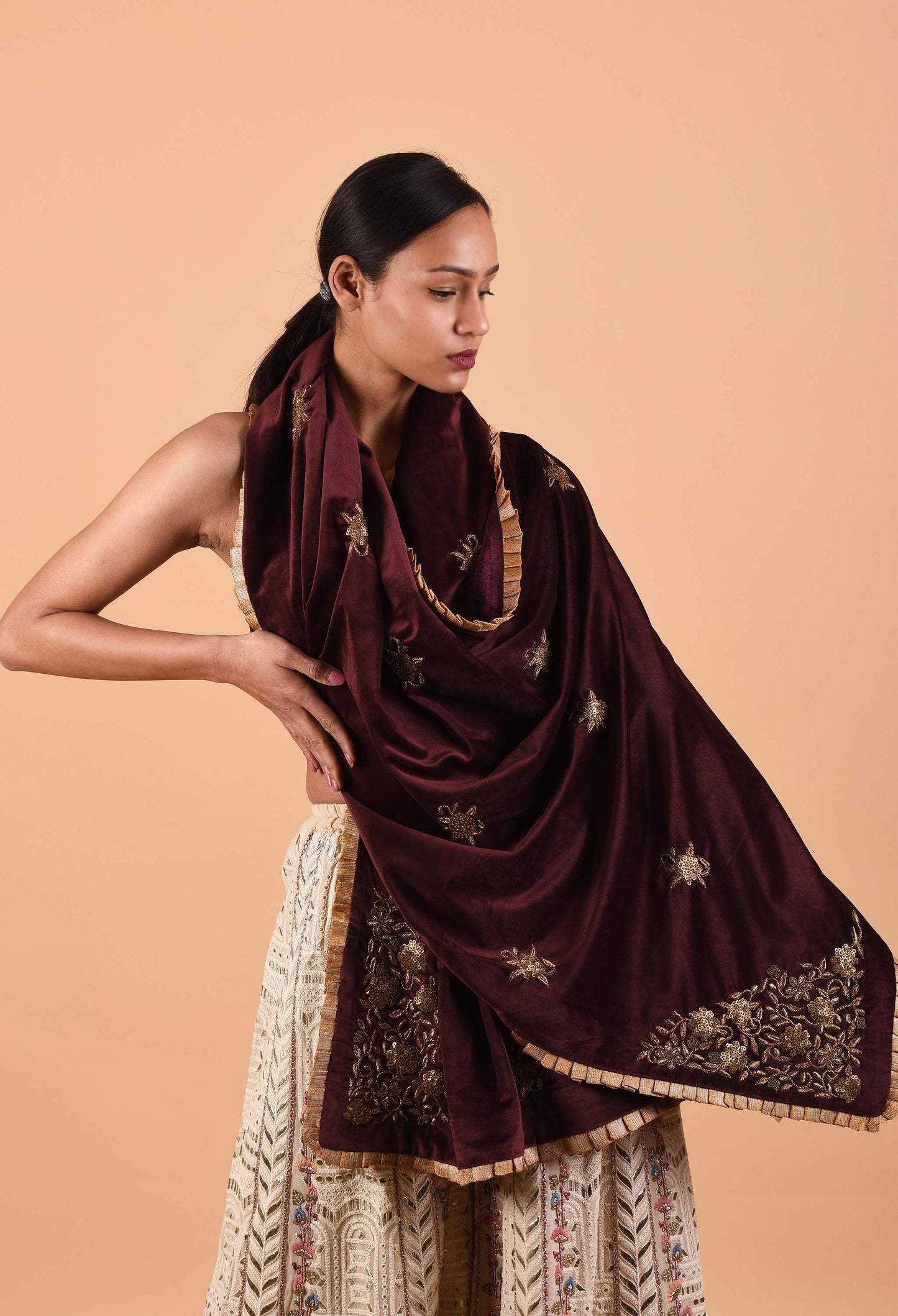 Model showcasing the wine-colored Ruhani Suede Velvet Shawl with intricate embroidery.