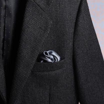 Solid grey satin silk scented pocket square in jacket pocket for a luxurious look.