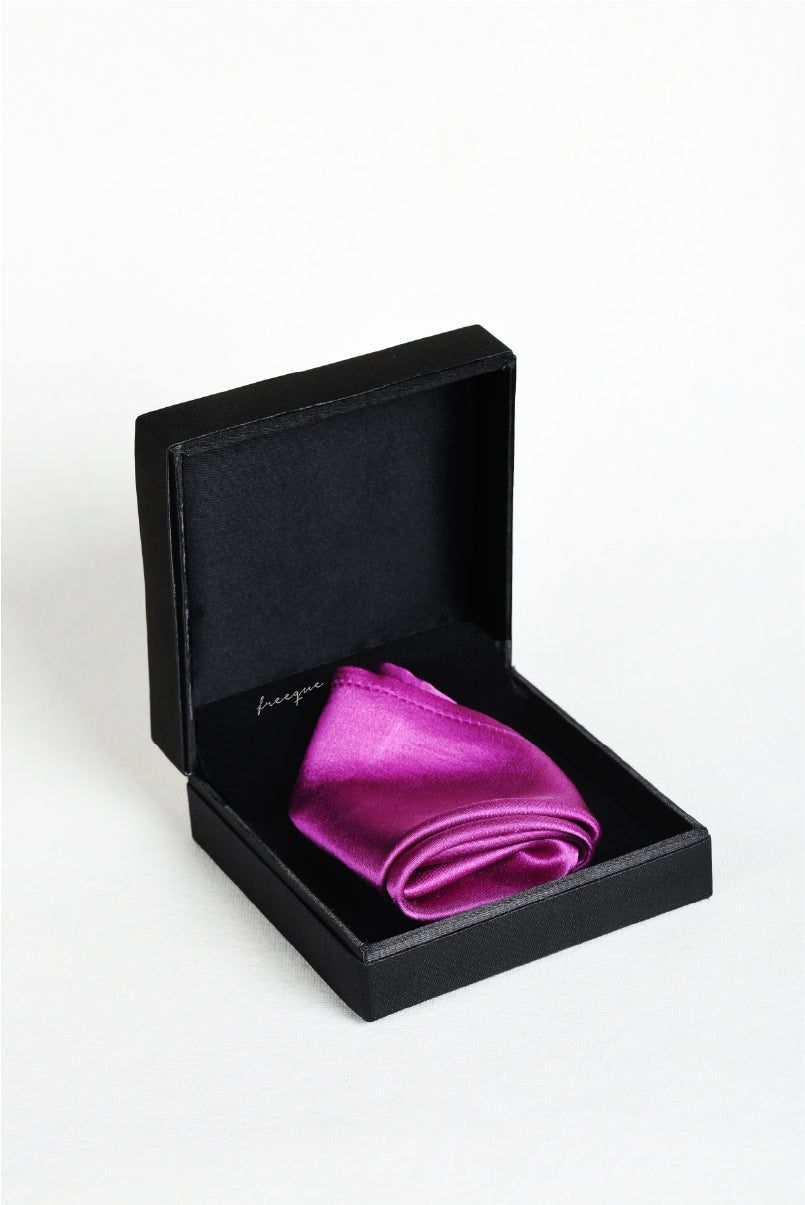 Solid magenta scented pocket square displayed in Freeque luxury box