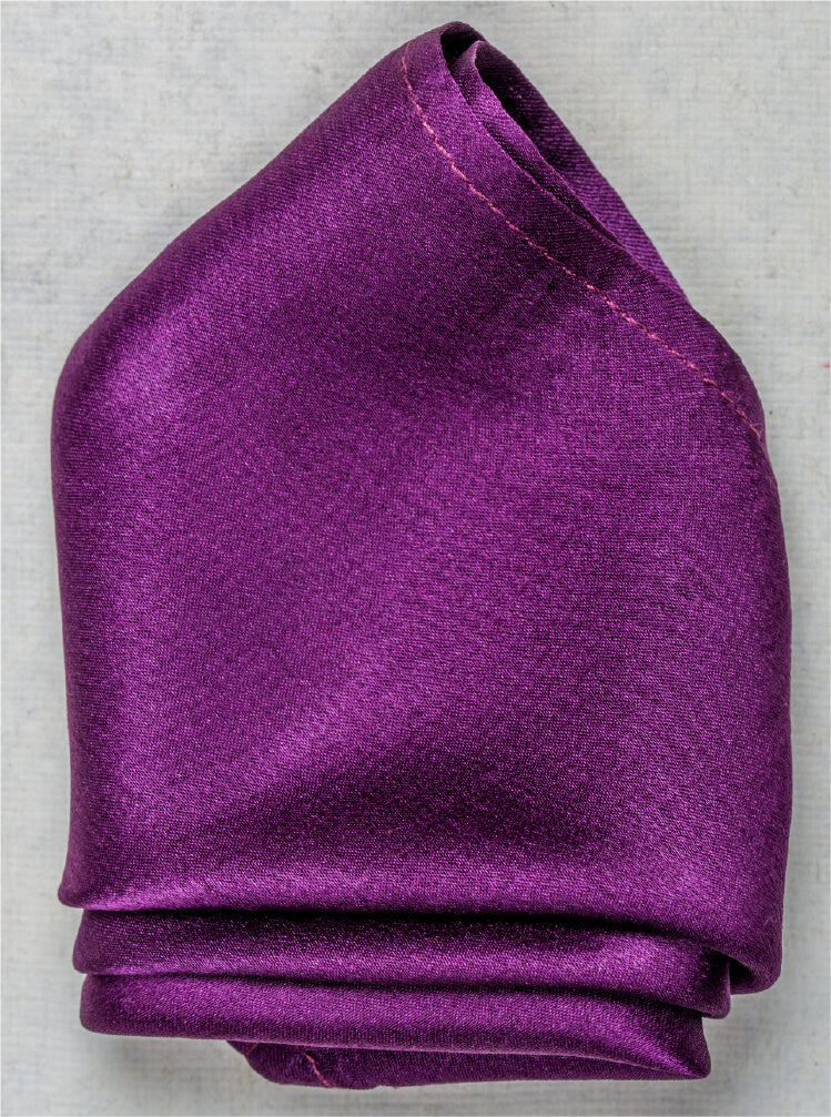 Close-up of solid violet satin silk pocket square with rich gloss