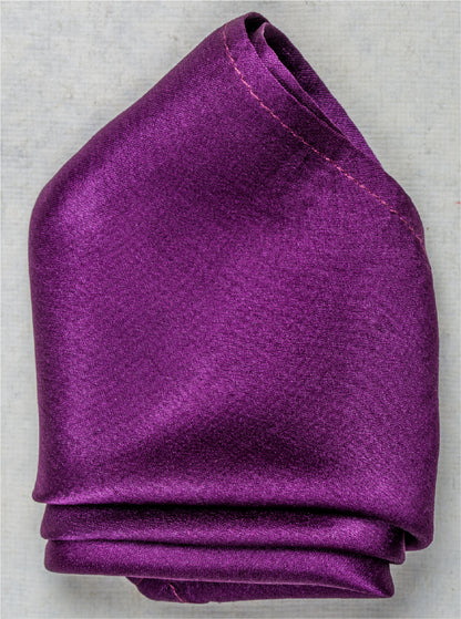 Close-up of solid violet satin silk pocket square with rich gloss