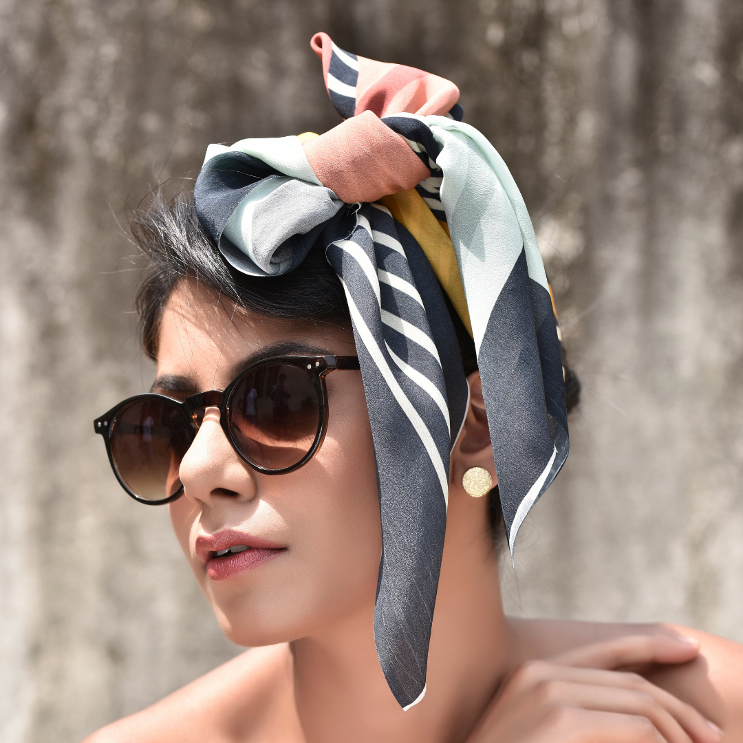 Woman wearing Freeque Striped Sundae scented scarf styled as a headwrap